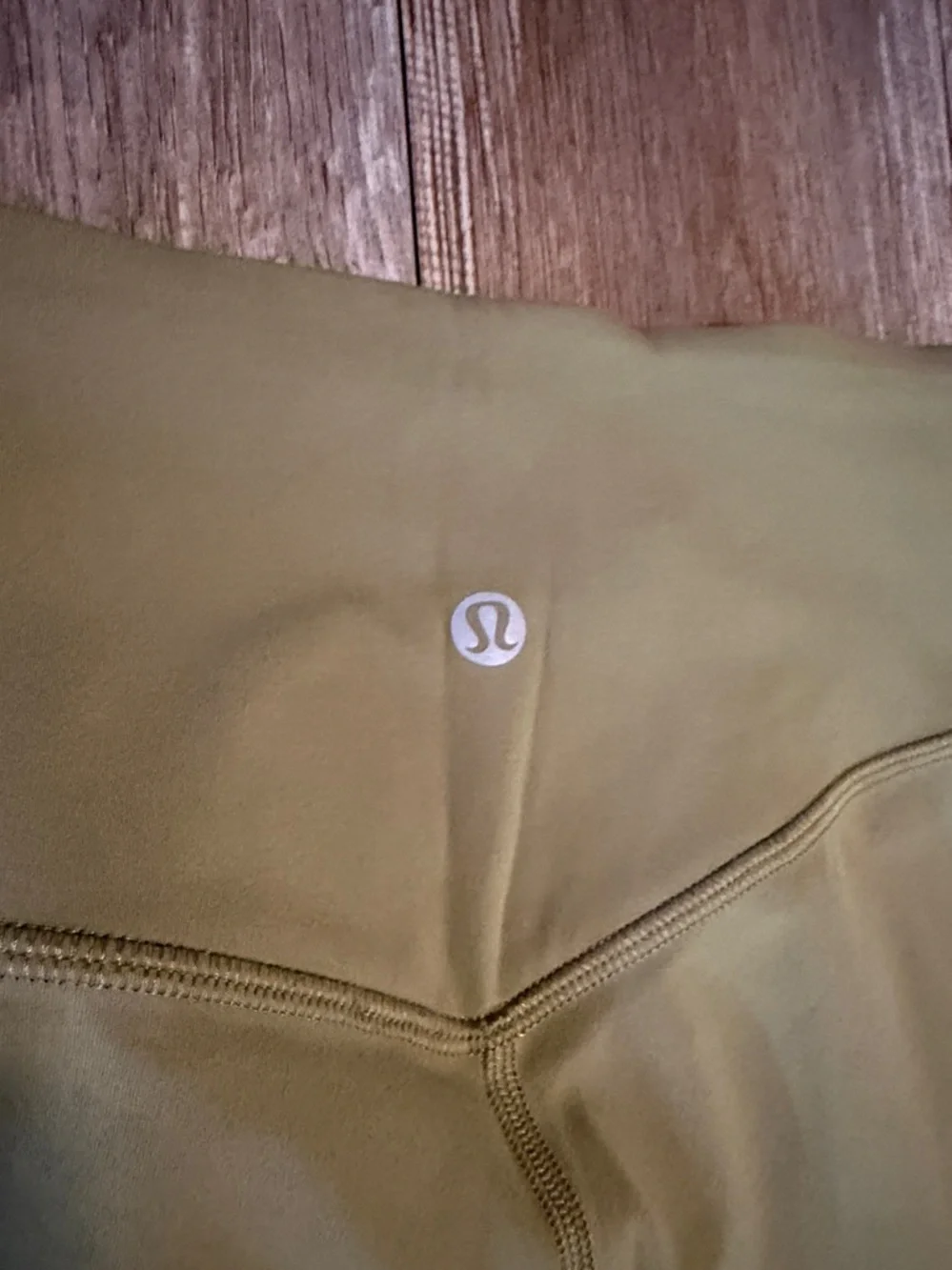 Lululemon Align High-Rise Cropped Jogger Capris in a bronze green color.